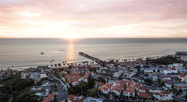 aerial view at dusk with a water view