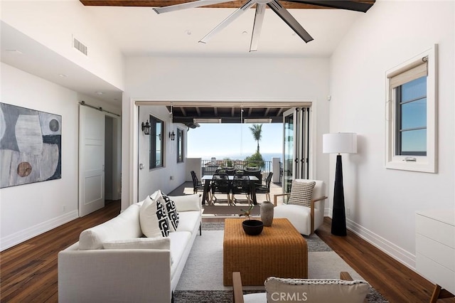 living room featuring dark wood-type flooring, lofted ceiling, and ceiling fan