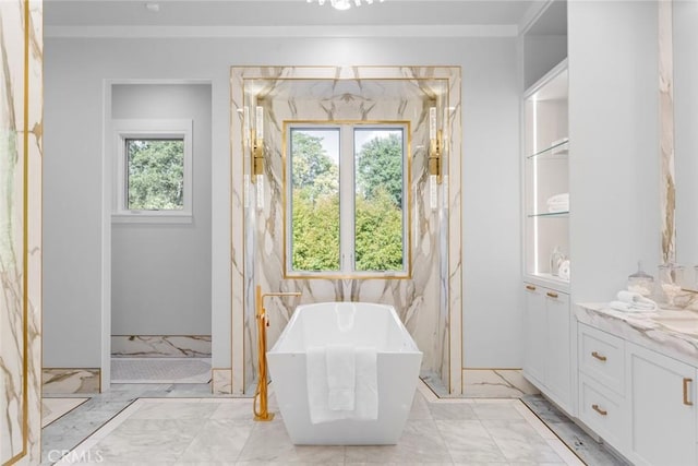 bathroom with a wealth of natural light, vanity, ornamental molding, and shower with separate bathtub