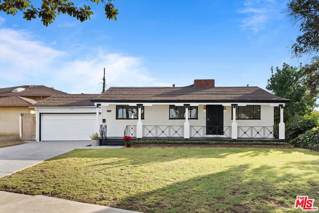 view of front facade with a front lawn and a garage