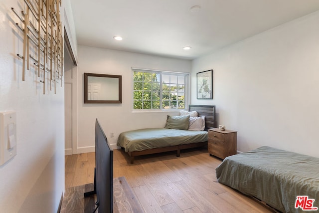 bedroom with light hardwood / wood-style floors