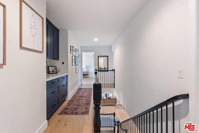 hall with light wood-type flooring