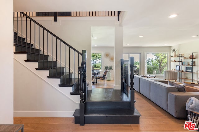 staircase featuring hardwood / wood-style flooring