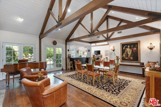 interior space featuring beam ceiling, french doors, and high vaulted ceiling