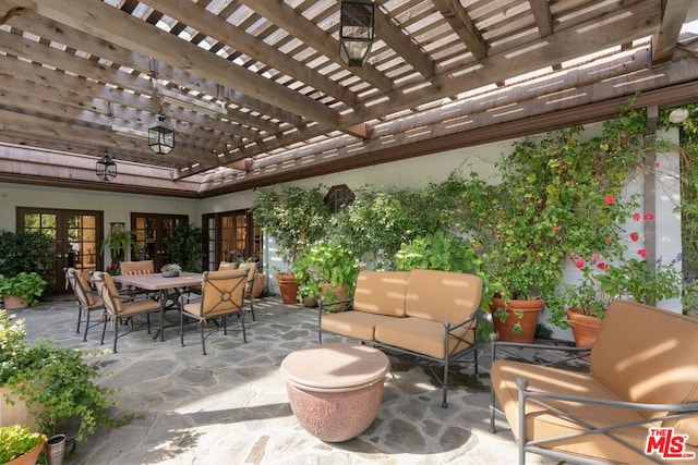 view of patio / terrace with french doors, a pergola, and outdoor lounge area