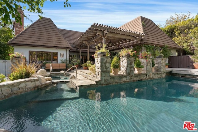 view of pool with a pergola, outdoor lounge area, and an in ground hot tub