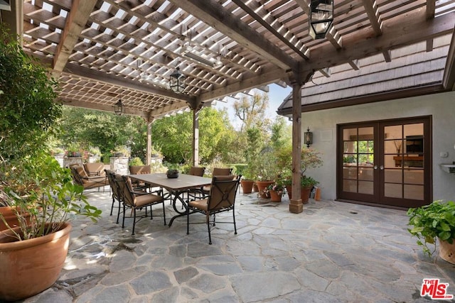 view of patio / terrace with french doors and a pergola