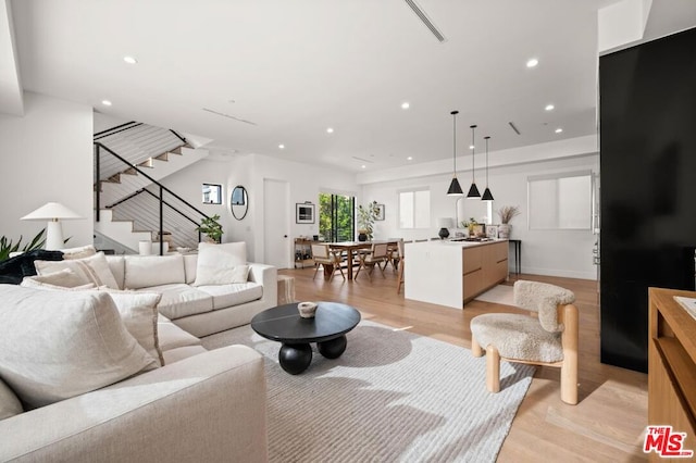 living room with light hardwood / wood-style flooring