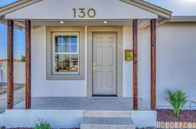 entrance to property featuring covered porch