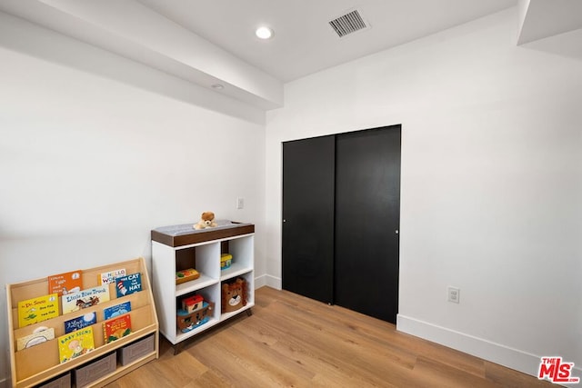 recreation room featuring hardwood / wood-style flooring