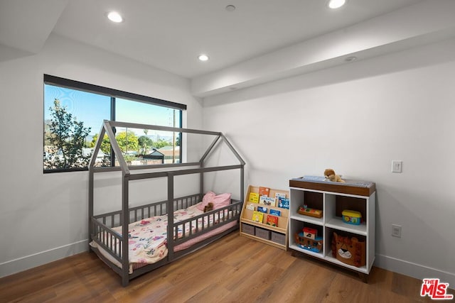 bedroom featuring hardwood / wood-style flooring