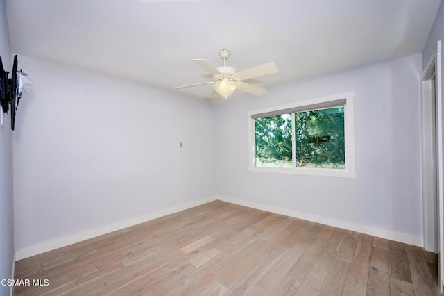 empty room featuring ceiling fan and light wood-type flooring