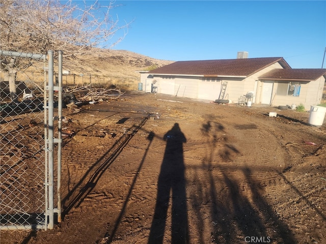 view of property exterior featuring a mountain view