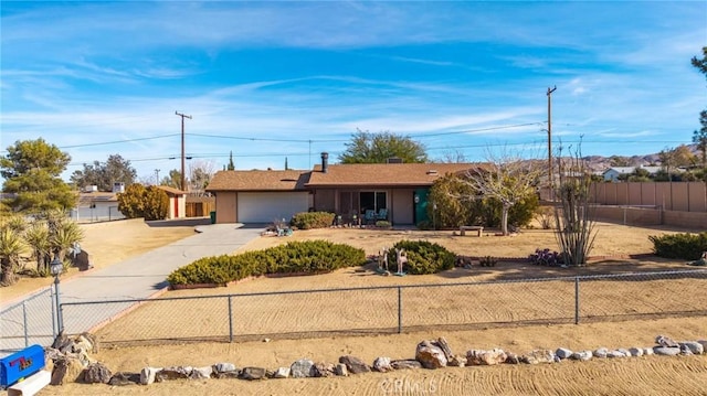 ranch-style home featuring a garage