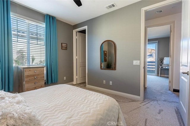 carpeted bedroom with ceiling fan