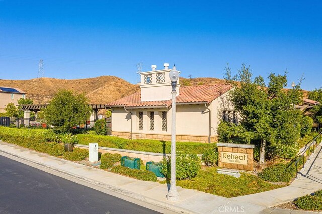 mediterranean / spanish-style home featuring a mountain view