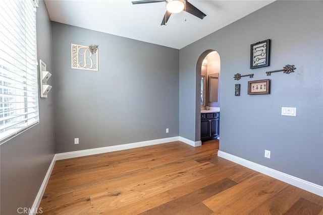 spare room with ceiling fan and hardwood / wood-style floors