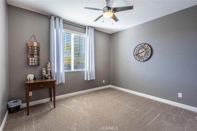 empty room with ceiling fan and carpet