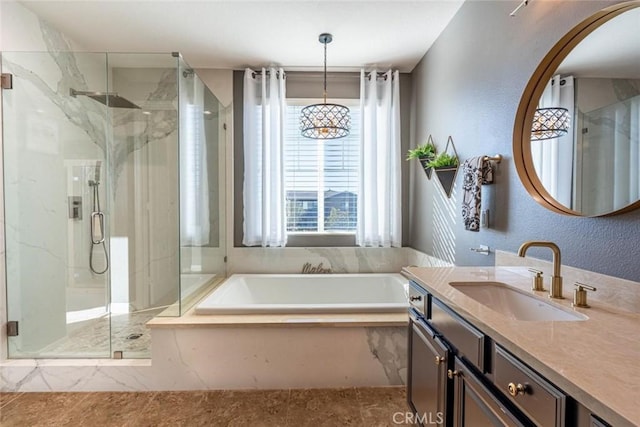 bathroom featuring vanity and separate shower and tub