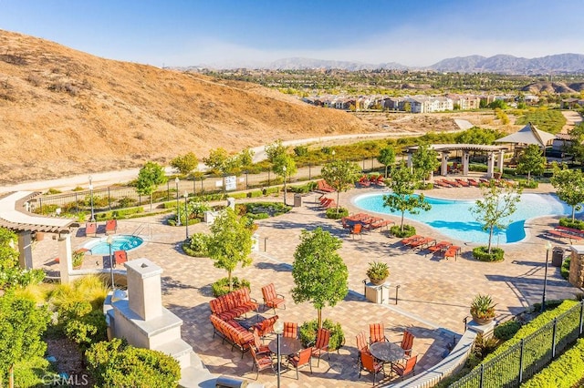 birds eye view of property featuring a mountain view