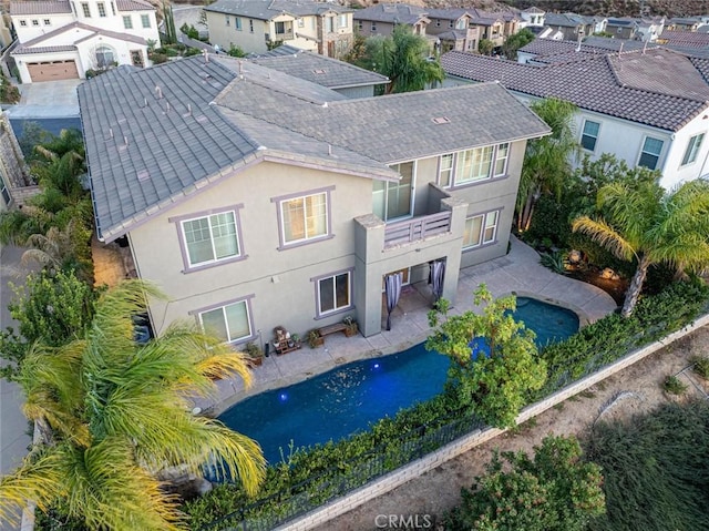 rear view of property with a balcony