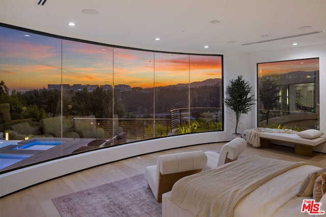 bedroom with light hardwood / wood-style flooring