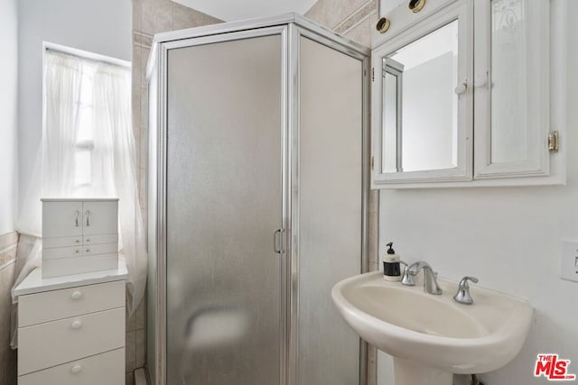 bathroom featuring sink and walk in shower