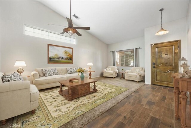 living room with ceiling fan, dark hardwood / wood-style floors, and high vaulted ceiling