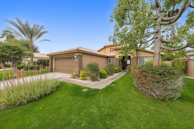 view of front of house featuring a garage and a front lawn