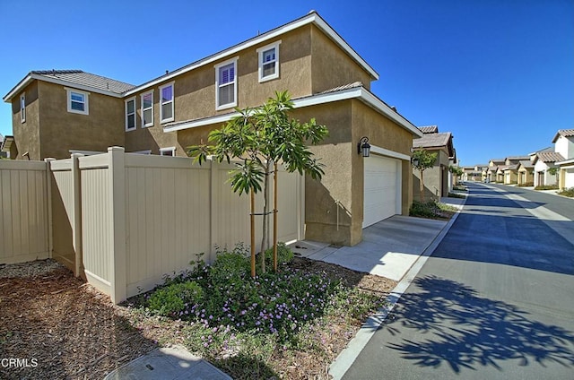 view of side of property featuring a garage