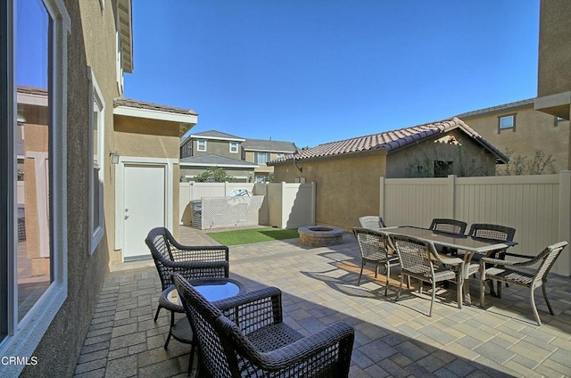 view of patio with an outdoor fire pit