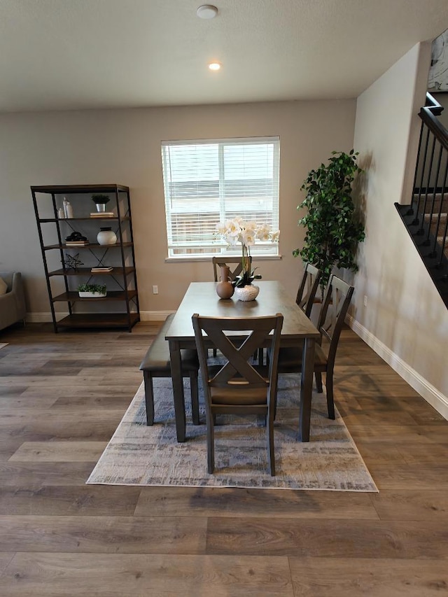 dining area with wood-type flooring