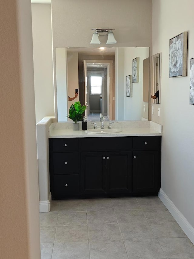 bathroom with vanity and tile patterned floors