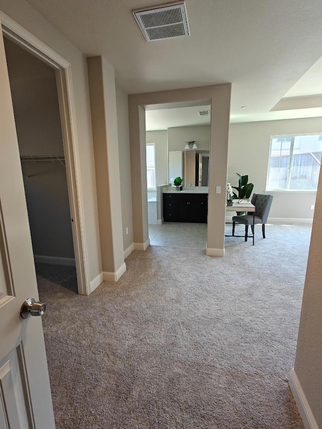 corridor with carpet floors