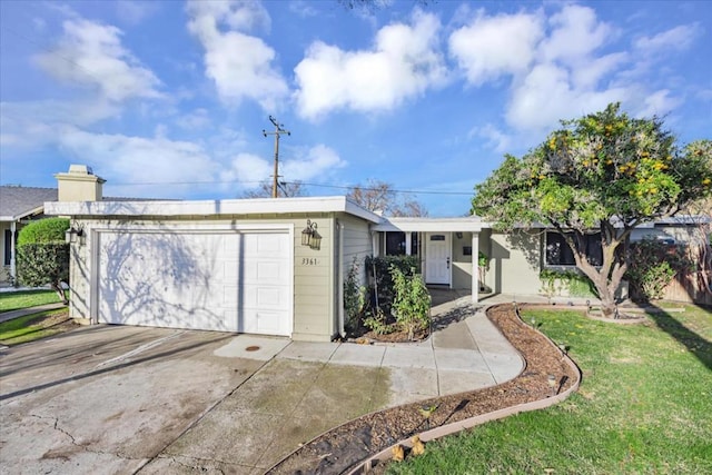 ranch-style home with a front yard and a garage