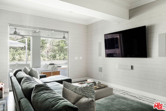 living room featuring ceiling fan and ornamental molding