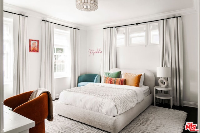 bedroom featuring crown molding