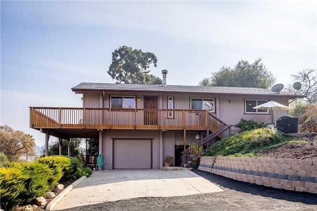 view of front facade featuring a garage and a deck