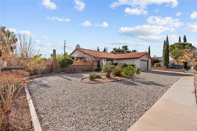 ranch-style home featuring a garage