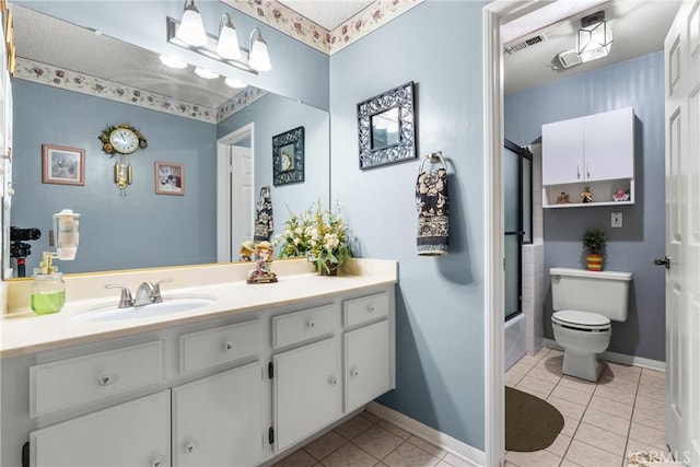 full bathroom with tile patterned floors, enclosed tub / shower combo, vanity, and toilet