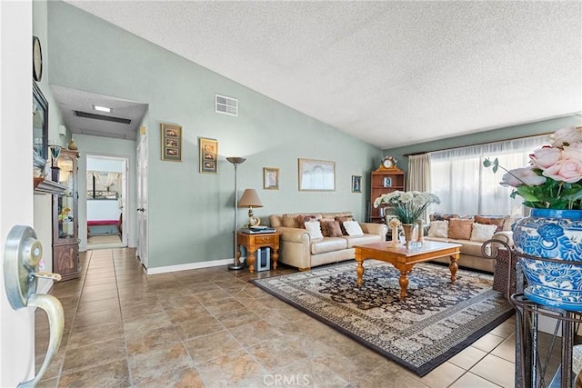 living room featuring vaulted ceiling and a textured ceiling