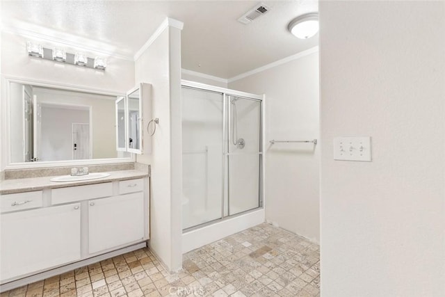 bathroom with walk in shower, crown molding, and vanity