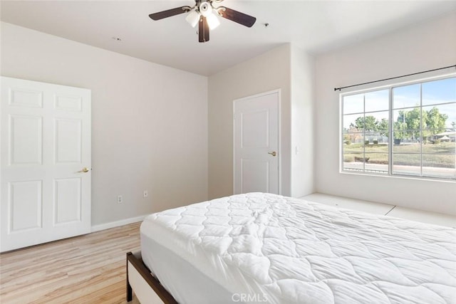 bedroom featuring ceiling fan and light hardwood / wood-style floors