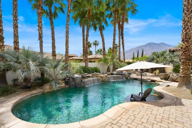 view of pool featuring a mountain view and pool water feature