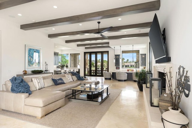 living room with beam ceiling, a premium fireplace, and french doors