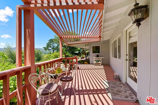 deck featuring a pergola