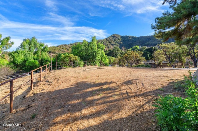 exterior space with a rural view and a mountain view