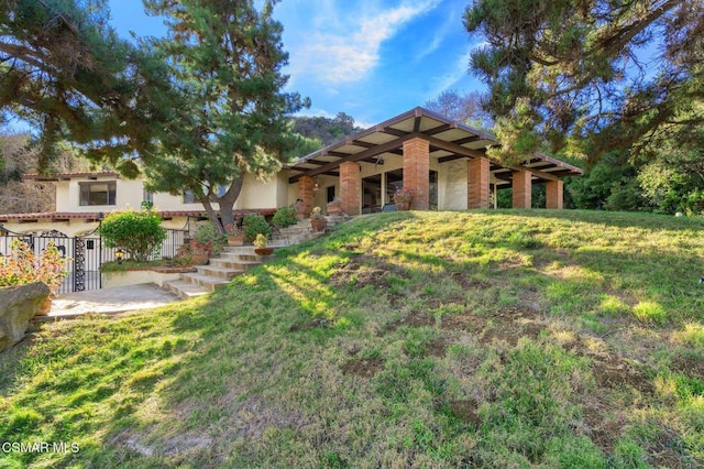 view of front of property with a front lawn