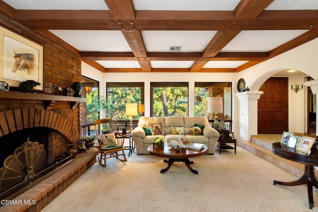 carpeted living room featuring beam ceiling, a fireplace, and coffered ceiling