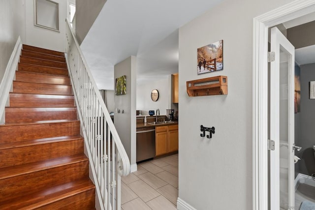 stairs featuring sink